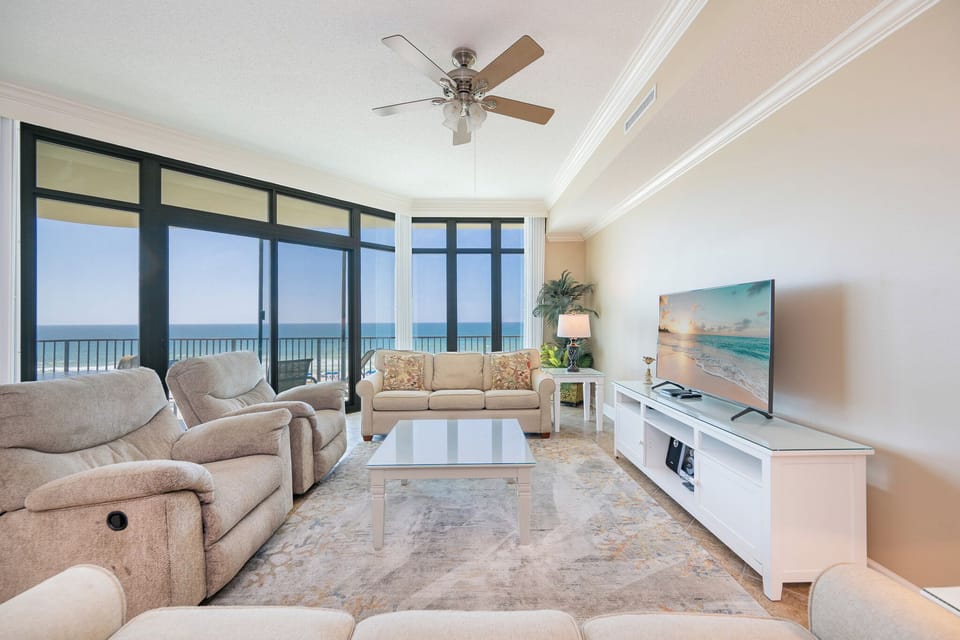 In the living room, you relax into plush recliners while watching your favorite movie and glimpse the gulf beyond