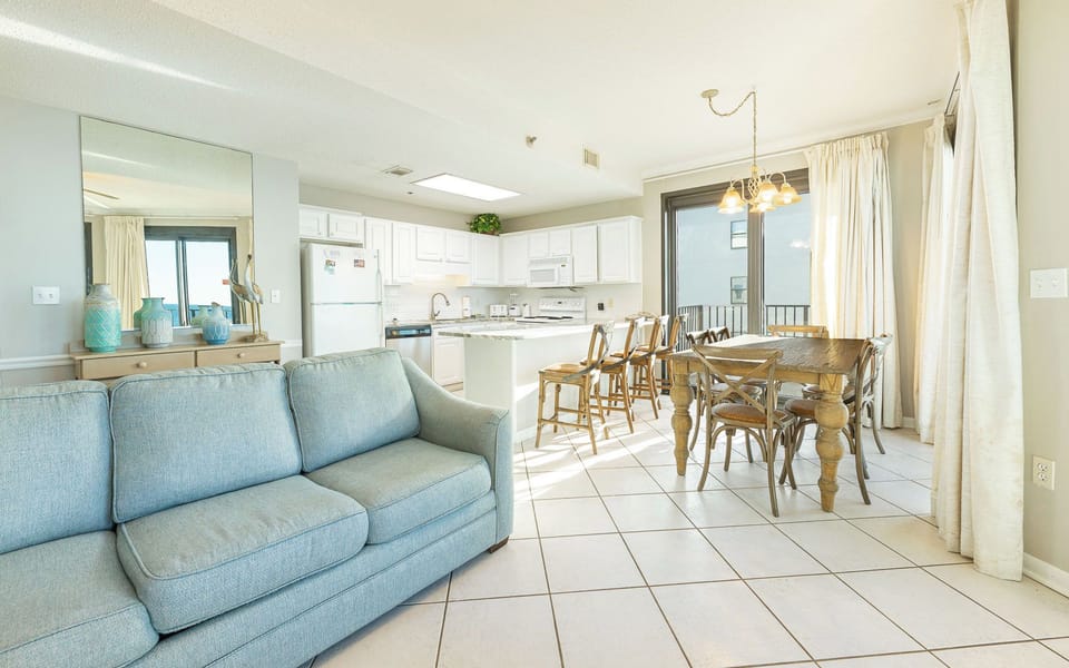 Relax on your couch with a queen sleeper while enjoying the coastal views from the balcony