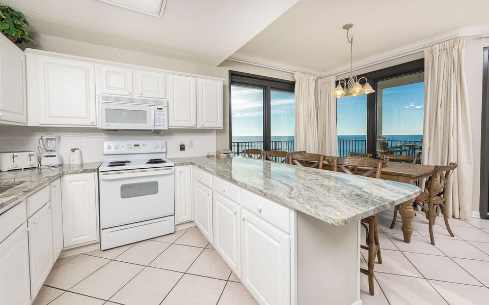Experience the joy of family gatherings around the charming dining table while enjoying stunning coastal views