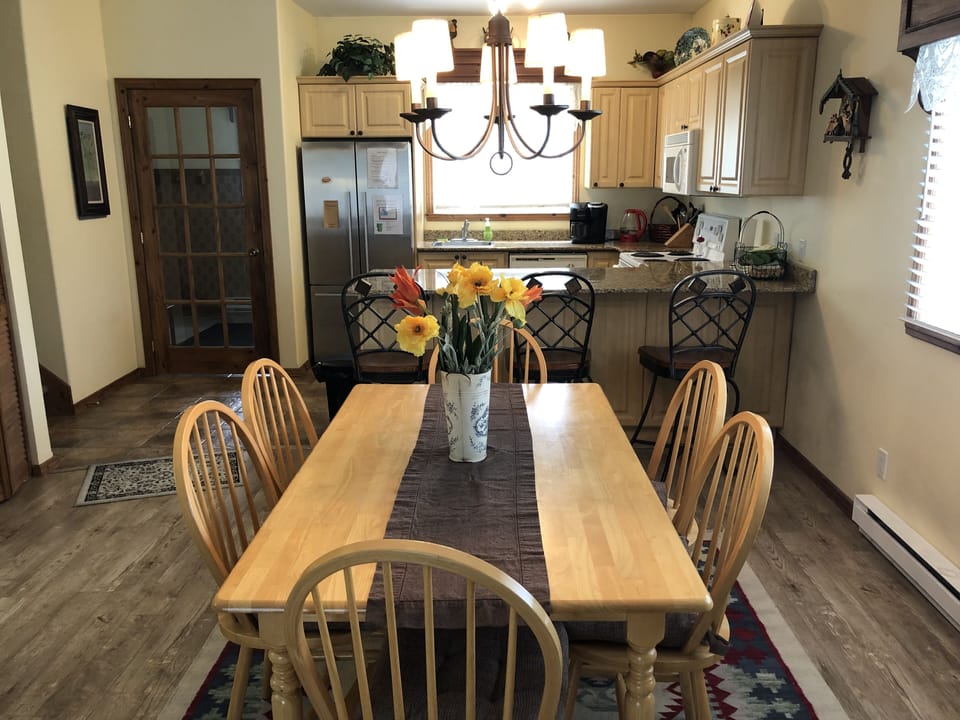 Dining Area looking to kitchen -breakfast bar and vestibule