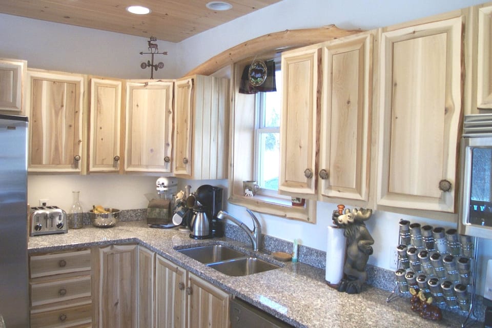 Stainless appliances with Rustic livedge cabinets..find the Moose?