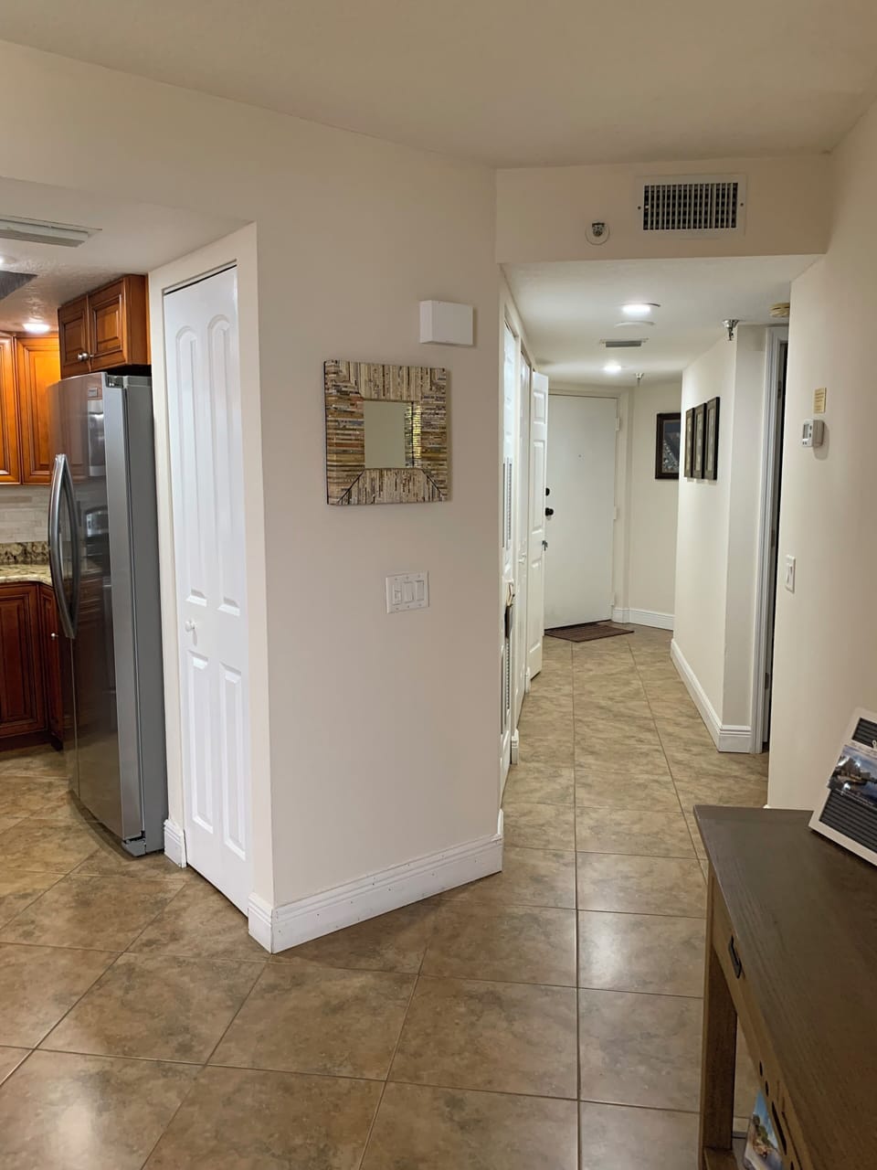 Condo entry and separate laundry room.  Beautiful kitchen to the left. 