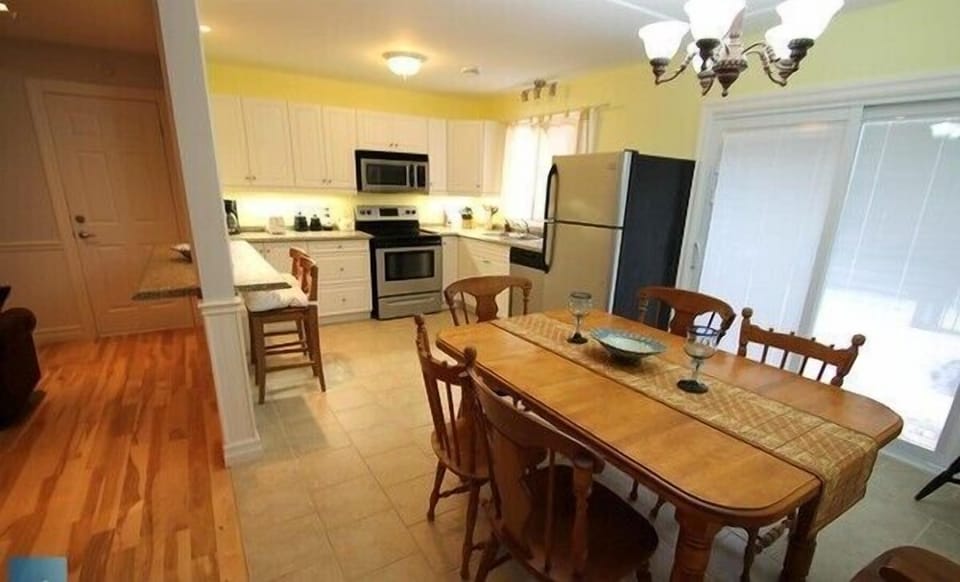 Full size kitchen in upper unit with Full size major appliances, refrigerator, stove, microwave and dishwasher - also some small appliances for your convenience
