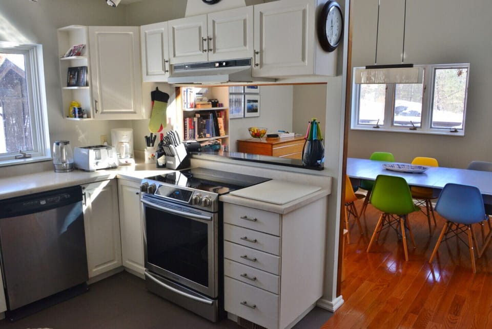 This fully stocked kitchen makes meal prep easy. The bright kitchen and dining areas are adjacent.