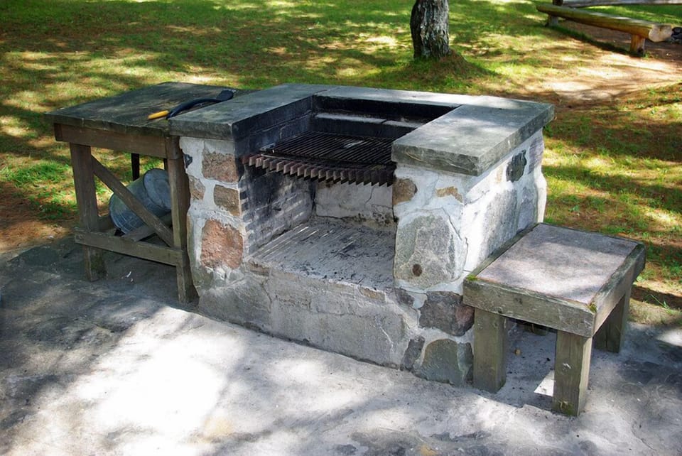 Barbeque with moveable grill. Firewood supplied