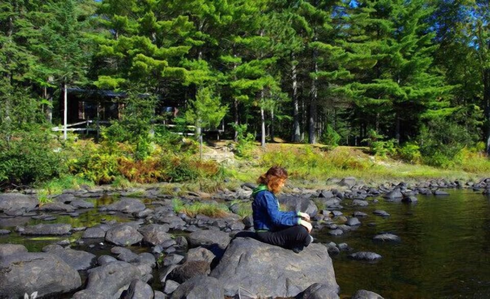 Meditating on a river boulder