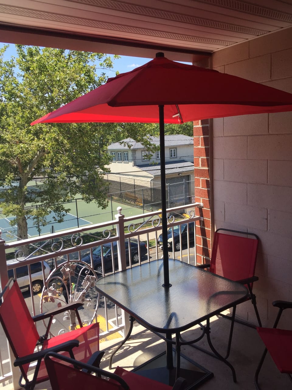 Front deck complete with table, chairs, and umbrella for your enjoyment.