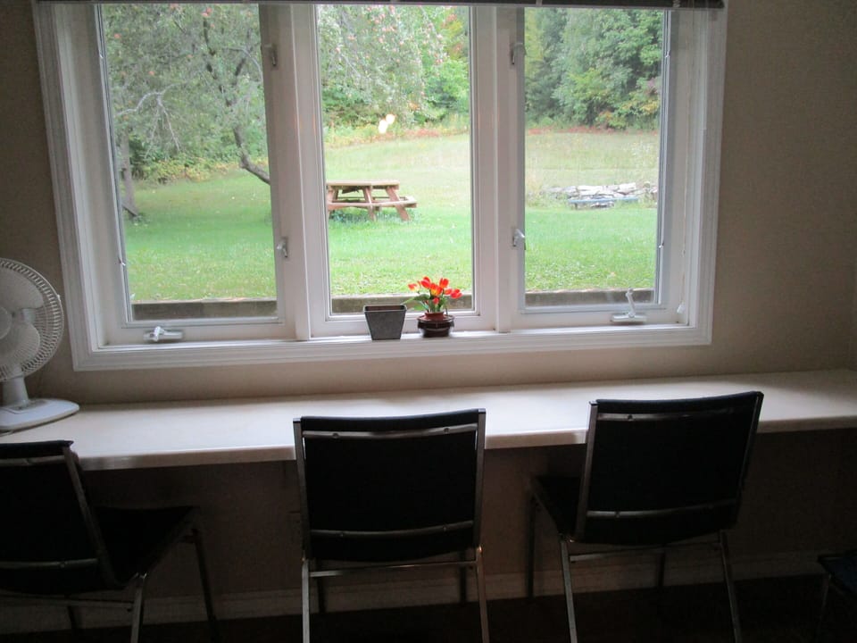 Kitchen seating, looking out to the private back yard and forest.
