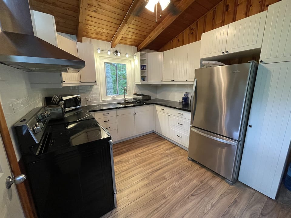 Cottage 1 kitchen fully stocked. Quartz countertops and stainless appliances