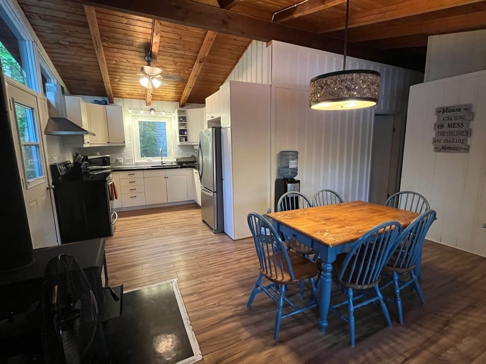 Cottage 1: Kitchen and dining. Wood stove for cool days.