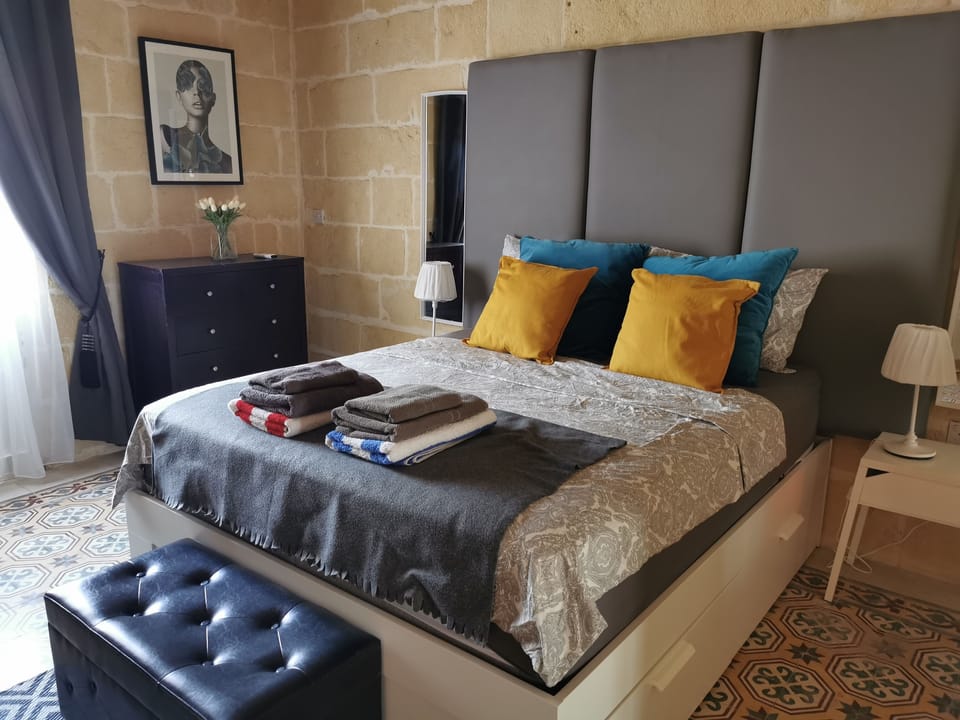 Master ensuite bedroom with balcony overlooking the pool + AC