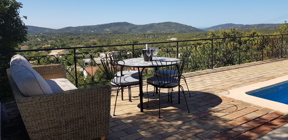 Stunning and relaxing panoramic views from the pool terrace overlooking gardens