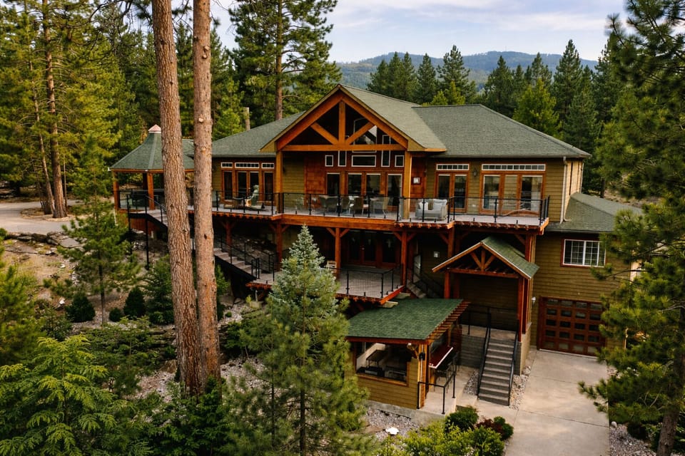 multi-level patio with water views. The hot tub is on the top level on the left.