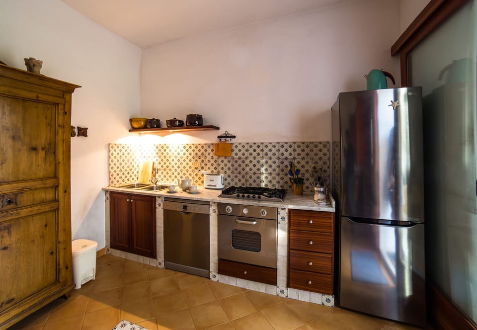 Kitchen with dishwasher, oven, toaster, refrigerator and fridge