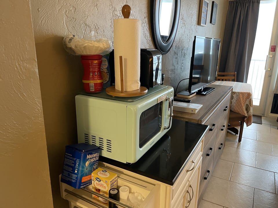Kitchen cart with microwave, toaster and coffee maker
