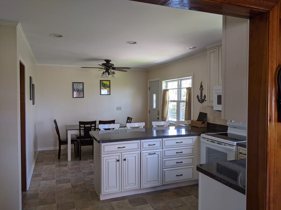 Kitchen with table and counter dining