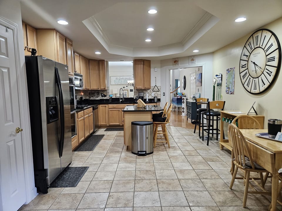 Spacious Kitchen w/Gas cooktop, Granite counters and Stainless-Steel appliances.