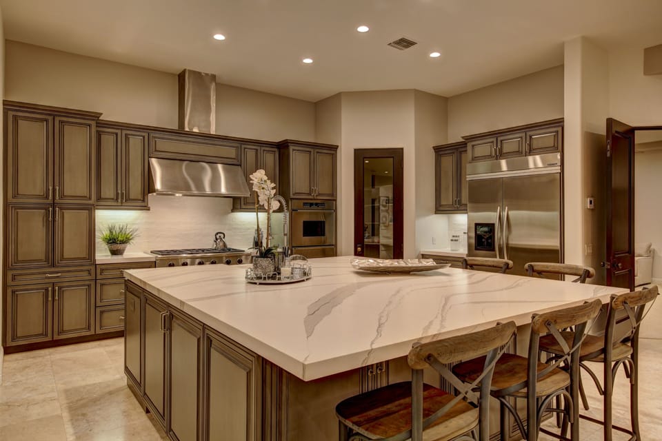 Chef's kitchen with stainless steel appliances, custom center island and bar seating for 6.