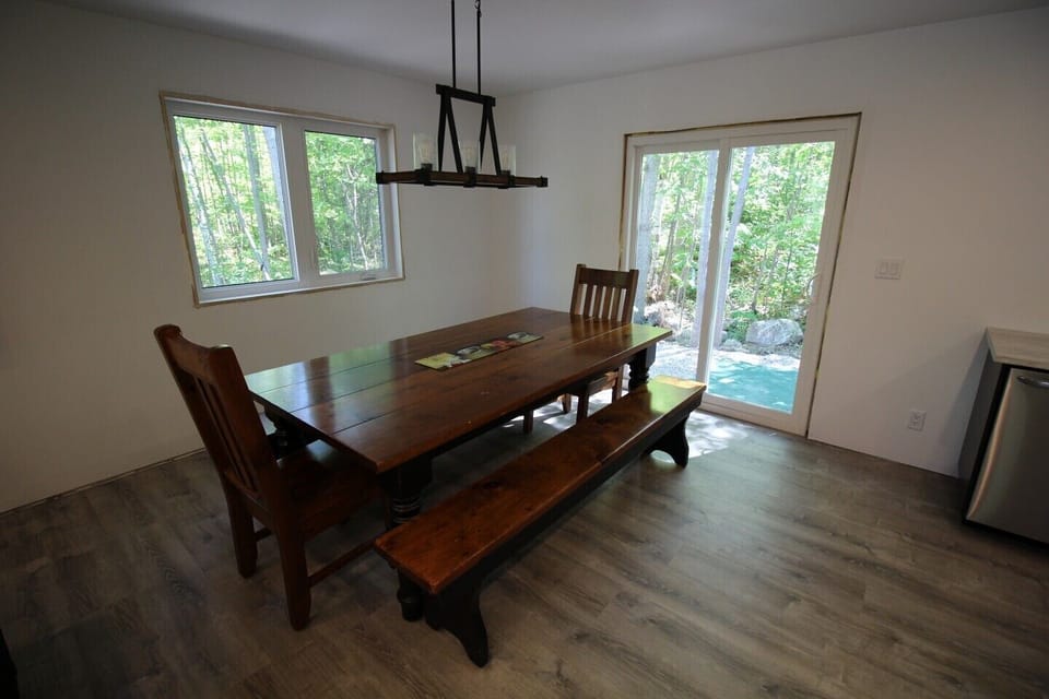 Patio doors leading to back yard and hot tub!