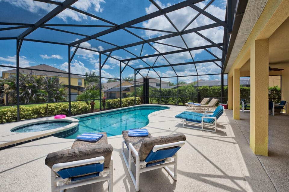 Pool area is screened with shrubs for privacy