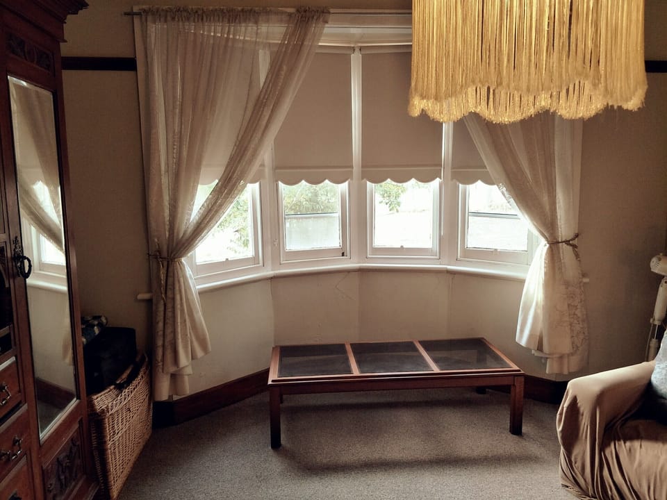 Queen bedroom with bay window