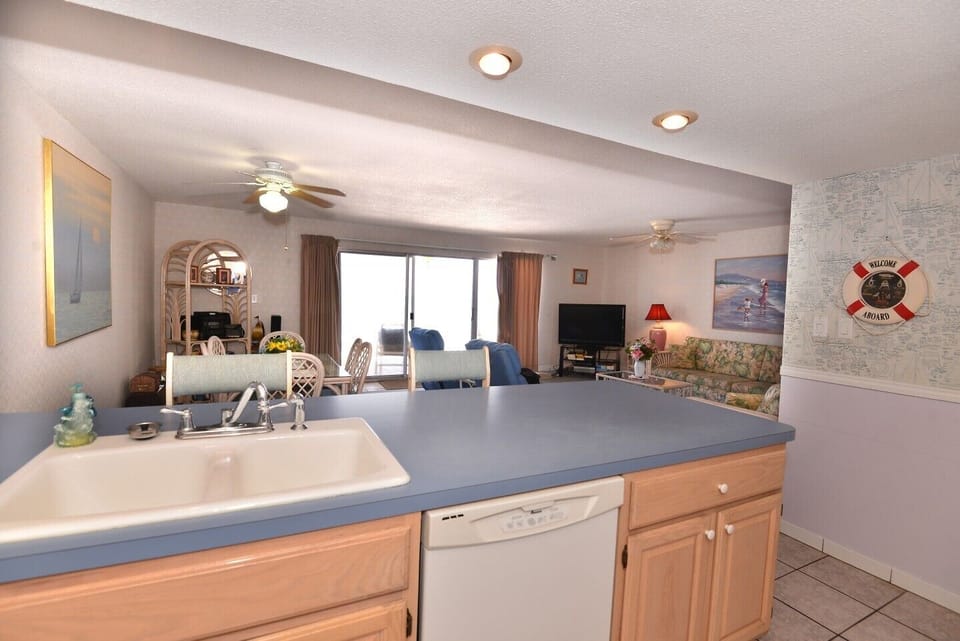 See the Gulf Outside the Patio Door While Cooking in the Kitchen