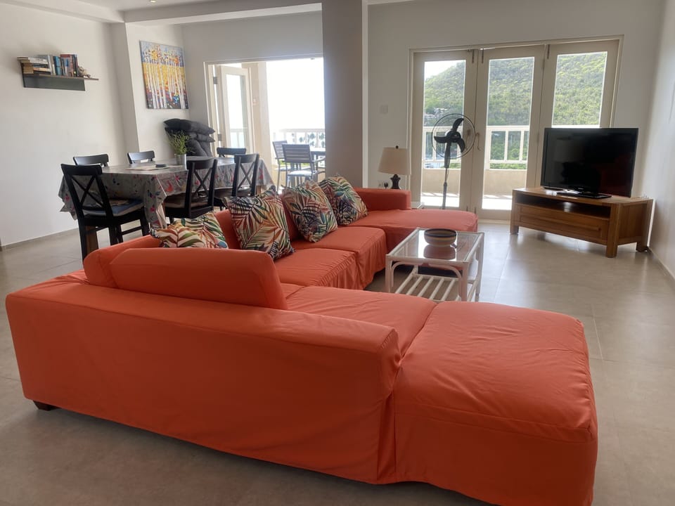 Your spacious dinning and sitting room with doors to the balcony