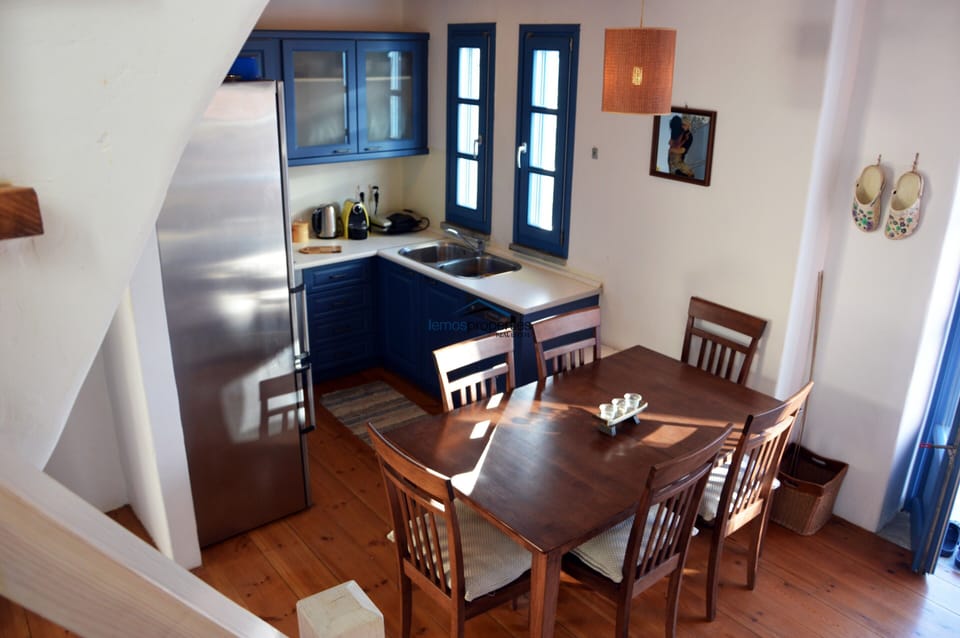A view of the kitchen and indoor dining area