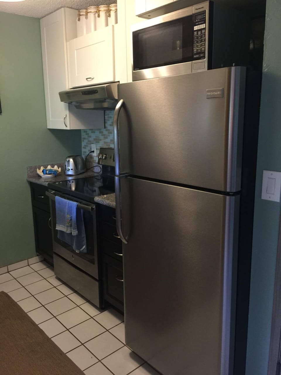 Full sized refrigerator and range.