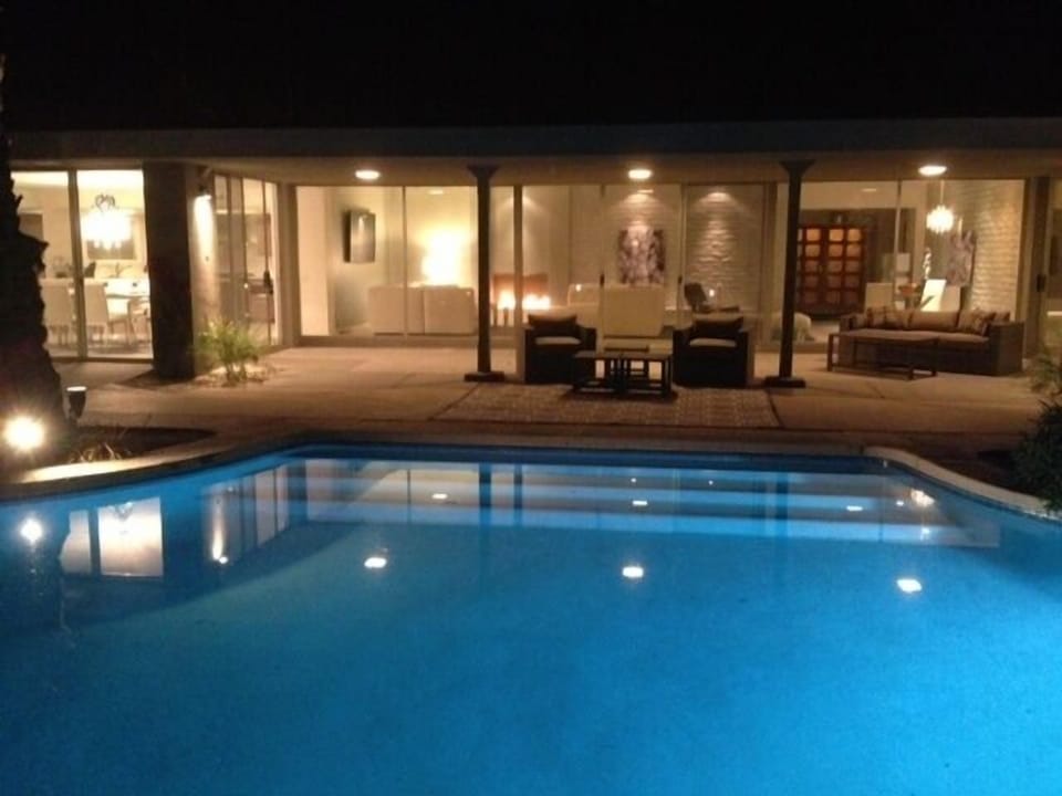 Lit pool and landscape lighting (not shown) create beautiful views at night.