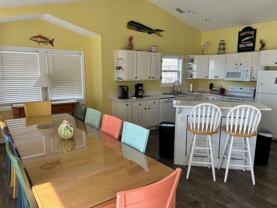 An open floor plan.  Breakfast bar to the left.  (The top is now white quartz)