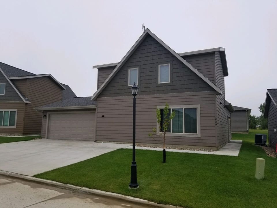 Cabin includes double garage w additional parking for up to 3 vehicles outside