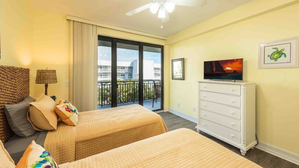 The second bedroom has a large flat screen TV...