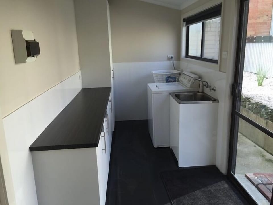 Large laundry with commerical washr and dryer