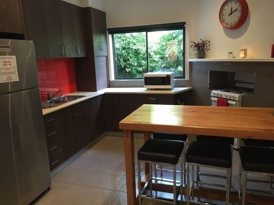 Large fridge and clean well stocked kitchen