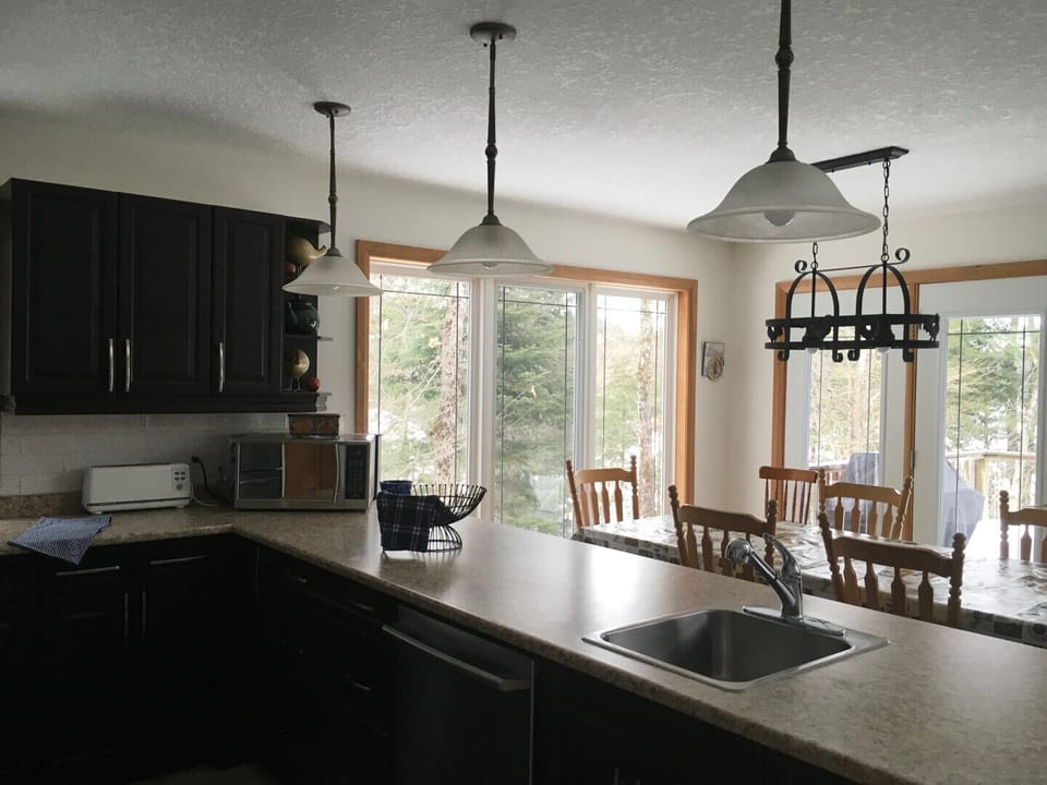 KITCHEN LOOKING INTO DINING ROOM