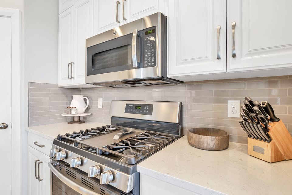 Fully stocked gourmet kitchen featuring top of the line appliances