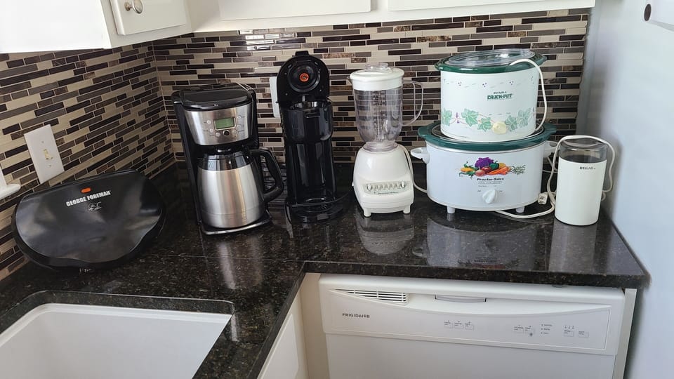 Foreman Grill, 2 coffee makers, blender,2 crock pots and a grinder. 