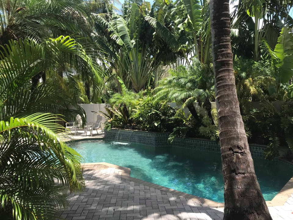 Step into a private oasis in the pool area where tropical plantings surround.
