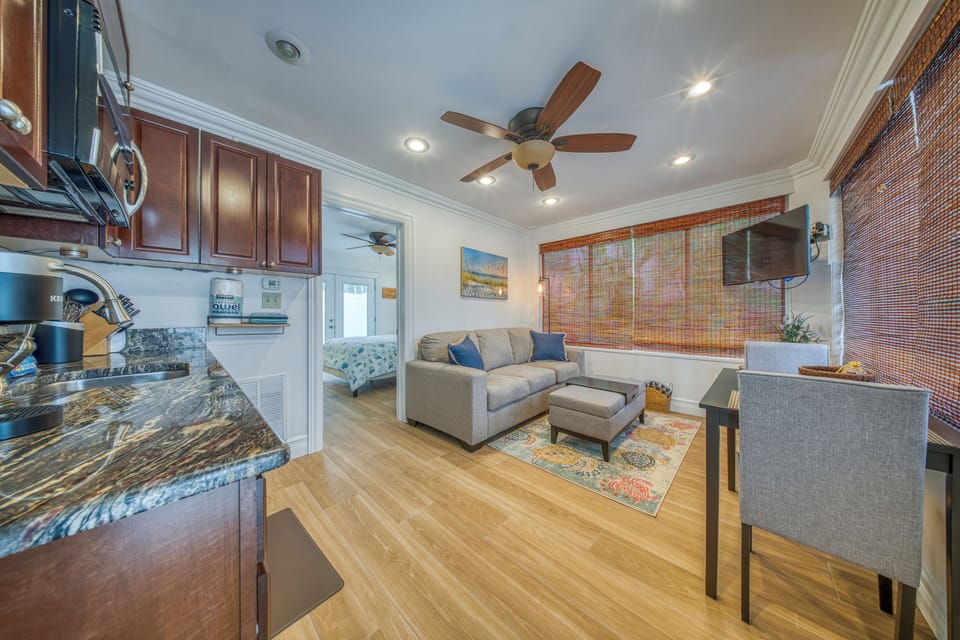 Kitchen/ living room offers a seating area designed for comfort to enjoy the tv.