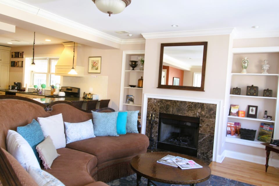 Italian marble surround enhances this gas log fireplace. 