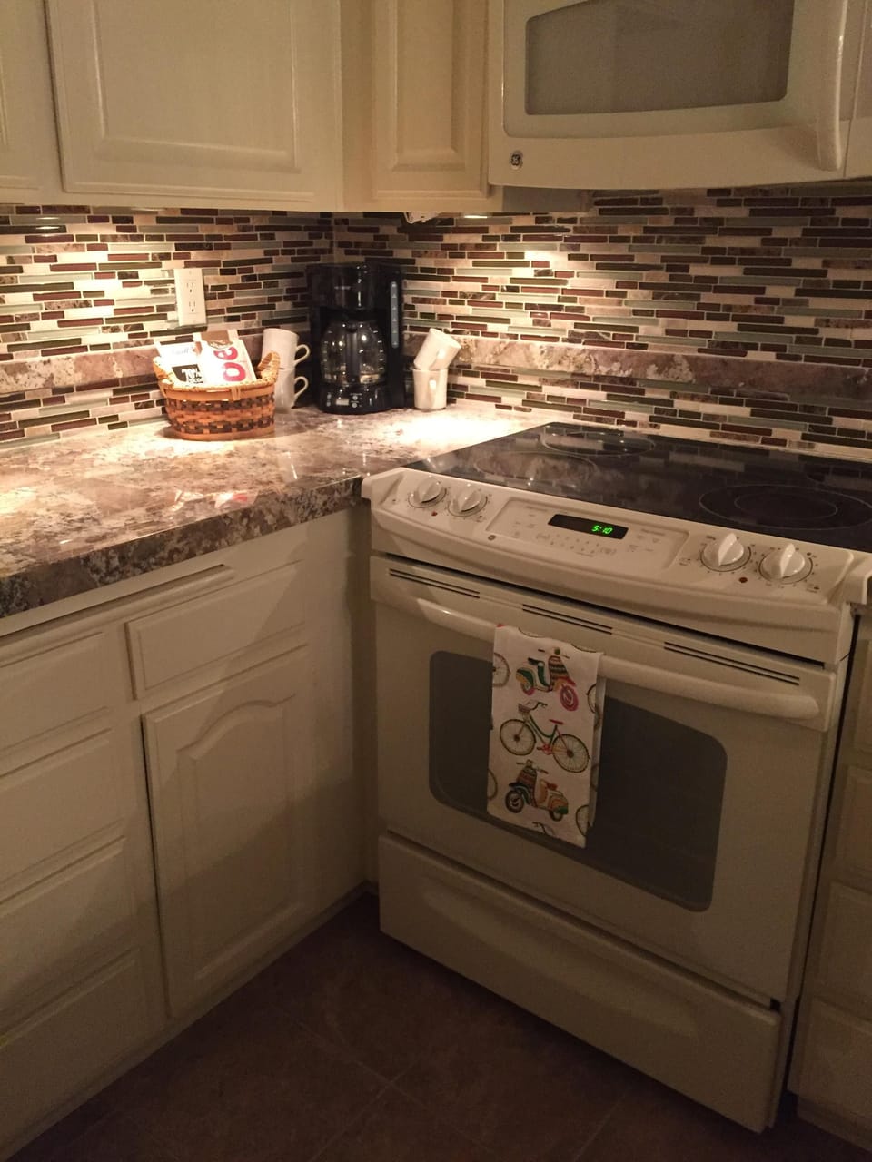 Under the counter lighting adds a warm feel to the kitchen in the evening. 