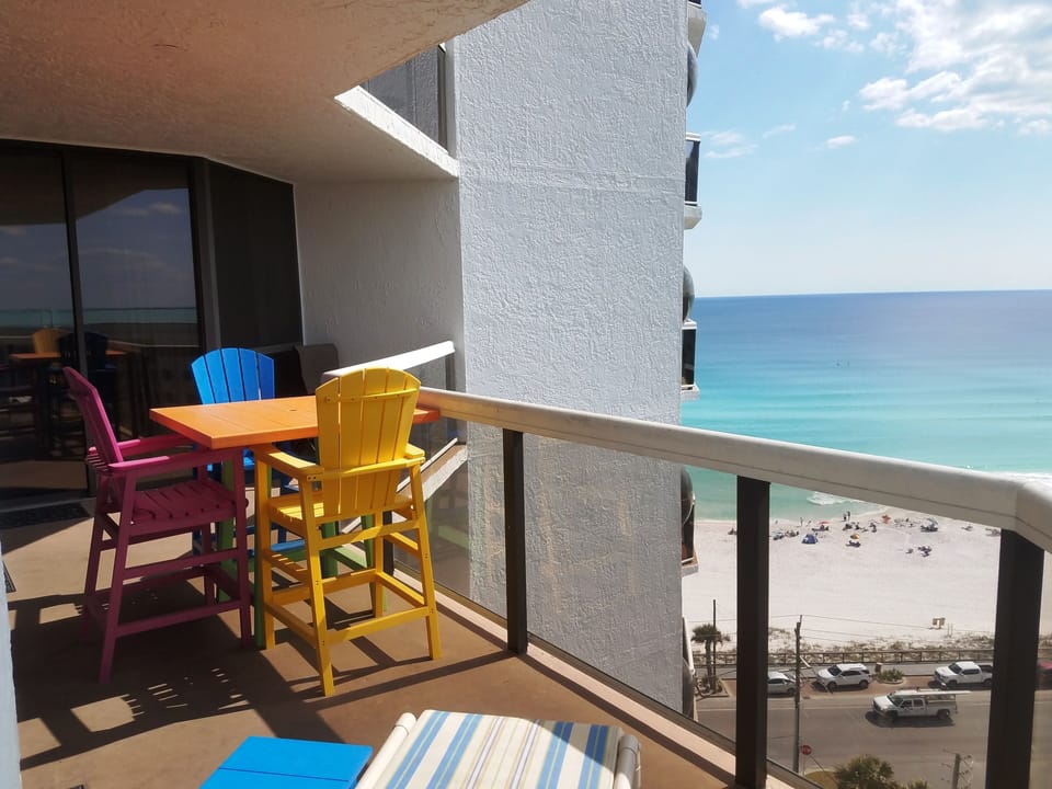 Large patio with new patio furniture and a lounge chair.