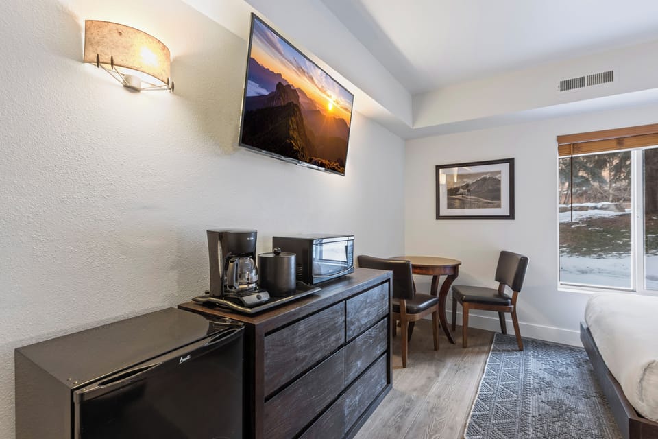 This is a beautiful hotel style room that offers a flat screen TV and sitting area.