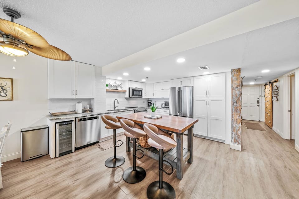 The beautifully updated modern kitchen is fully equipped with all the essentials you need to make delicious meals during your vacation