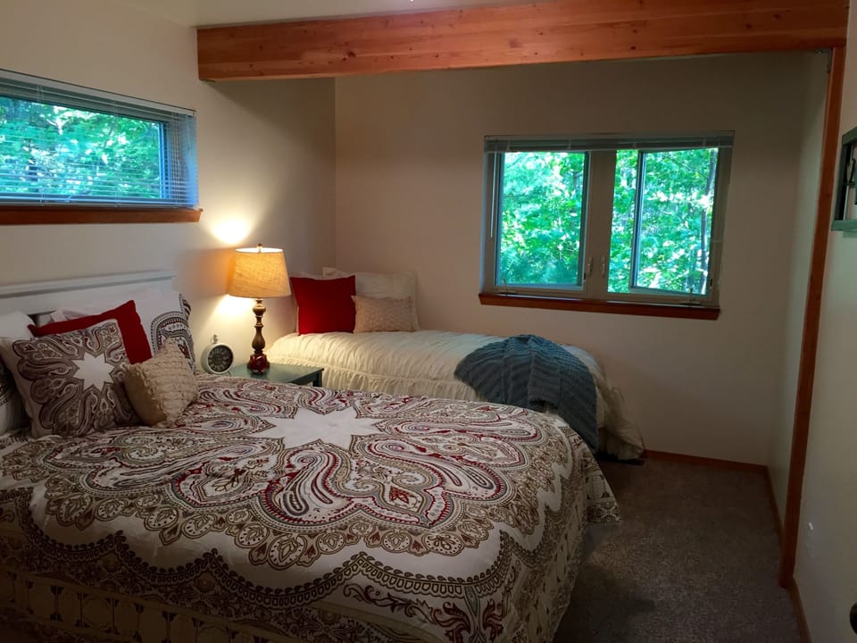 Bedroom #2 has a queen bed and a twin bed.