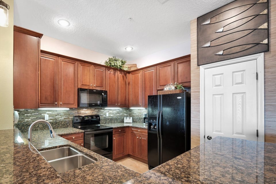 Fully updated kitchen featuring sleek granite countertops