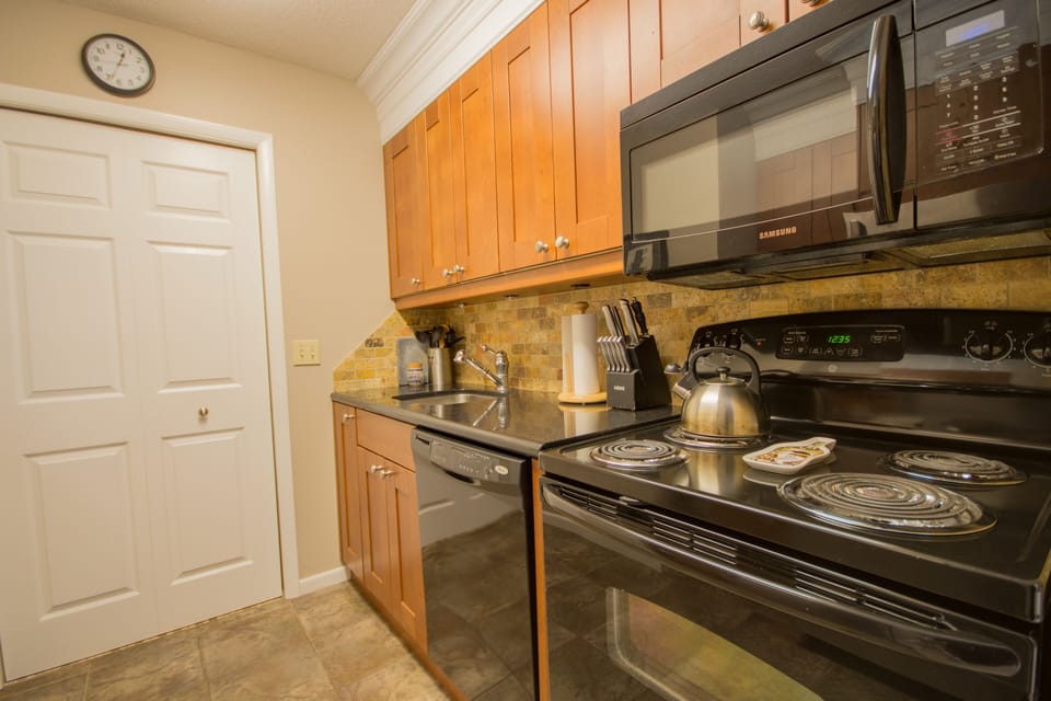 KItchen with cherry cabinets, granite countertops & new appliances