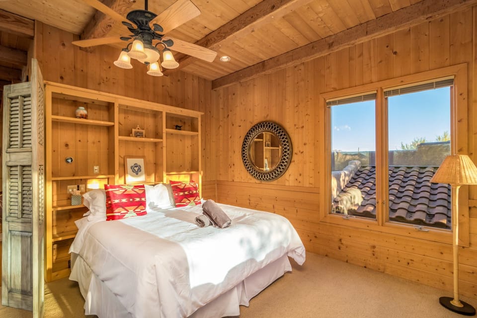 Experience the cozy charm of a loft featuring two beds, comfortable seating, and a warm fireplace. 🛏️🛋️🔥 #cozysleep
