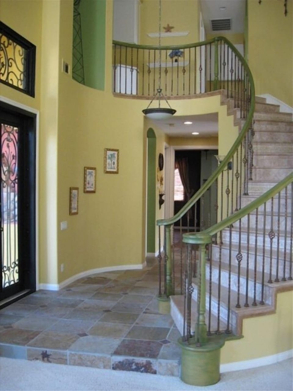 Unique Iron & Glass Front Doors, Slate Foyer and Grand Marble Spiral Staircase!